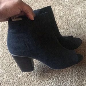 Black, ankle length peekaboo heels.